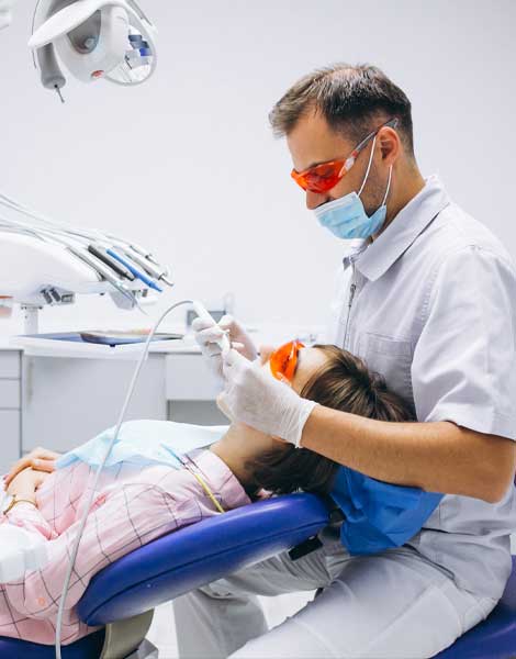 A dentist working on a patient